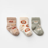 3-pack baby boy socks with car, lion, and deer patterns in soft neutral tones
